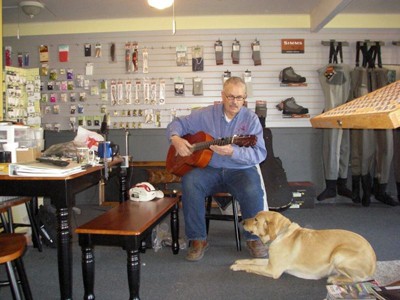 David D’Beaupre's dad was passing through and stopped to play guitar while others chatted in the shop. David D’Beaupre's dad was passing through and stopped to play guitar while others chatted in the shop.