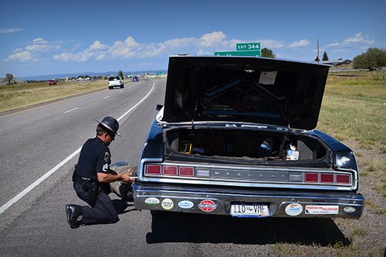 Cop helps replace Clyde’s tire on the way to Bozeman, Montana. Cop helps replace Clyde's tire on the way to Bozeman, Montana.