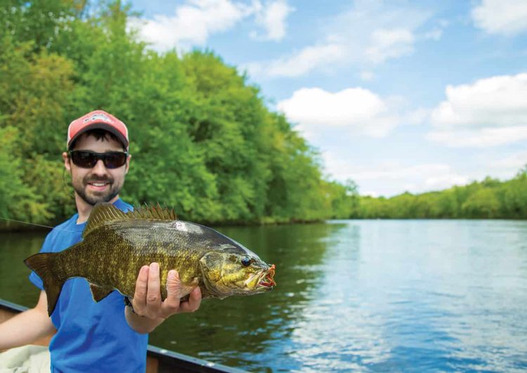 Fly fishing over Androscoggin River